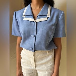 Pan Am flight attendant vibes.